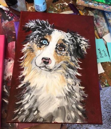 painting of an Australian Shepard with one blue eye and one brown eye