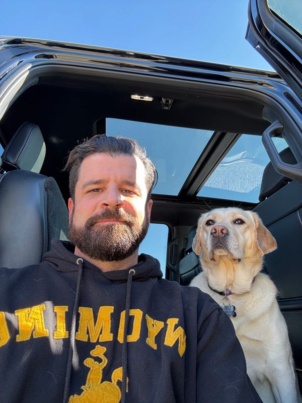 Drew Ballard & Ranger (yellow lab), founder of Monarch's Roost