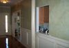 Color wash on walls, antiquing on wainscoting, subtle marble column 