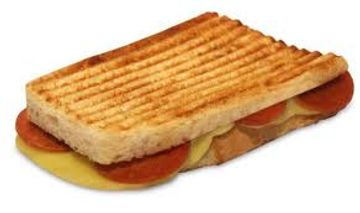 A grilled sandwich with cheese and pepperoni inside.