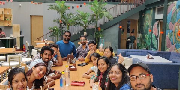 Group of friends enjoying beverages at a cafe.