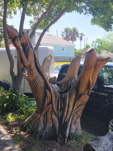 After Hurricane Ike, several trees were destroyed. Many of the residences would carve images from w