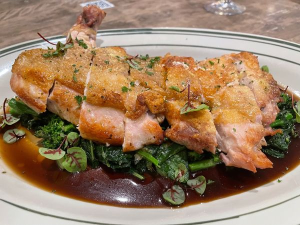 Roast Chicken on a bed of Rapini and jus