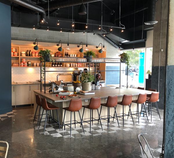 bar seating, restaurant shelving and painted cement floor