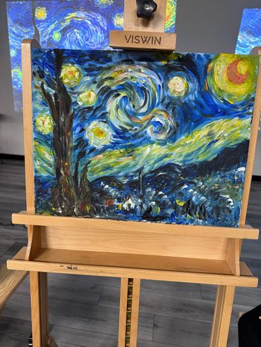 A vibrant painting inspired by Van Gogh's Starry Night on an easel.
