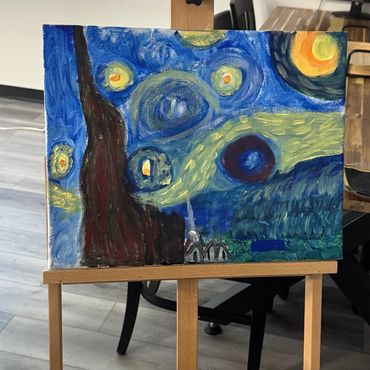 Painting inspired by Starry Night on an easel indoors.
