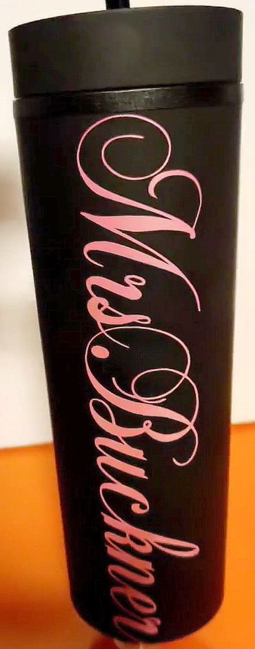 Personalized teacher tumbler cup with straw.