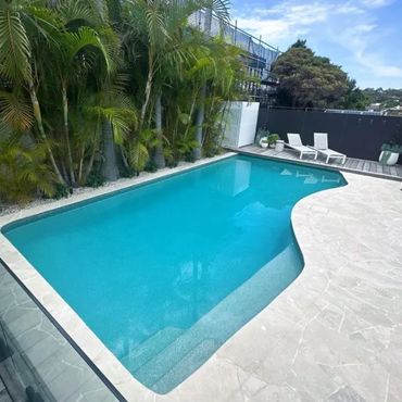 Modern backyard pool with clear blue water and surrounding palm trees.Bairnsdale landscaping
landscape design East Gippsland landscaping