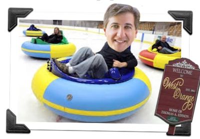 People with exaggerated heads riding colorful bumper cars on ice rink.