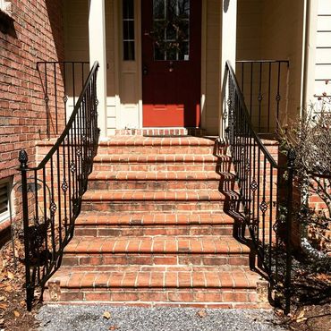 Rails with baskets every other picket scrolls and finials