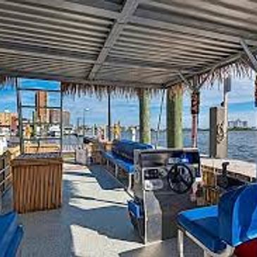 one of the tiki hut party boats operated by pirate paul at pensacola beach marina
