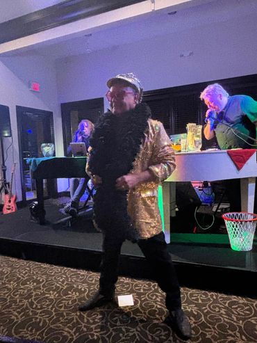 Guest performing at the 2024 Dueling Pianos fundraiser