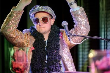 Guest dancing at the 2025 Dueling Pianos fundraiser