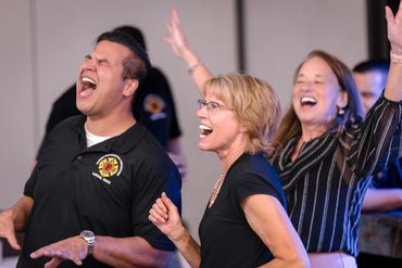 Guests celebrating at the 2025 Dueling Pianos Fundraiser