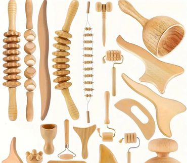 Various wooden massage tools arranged on a white background.