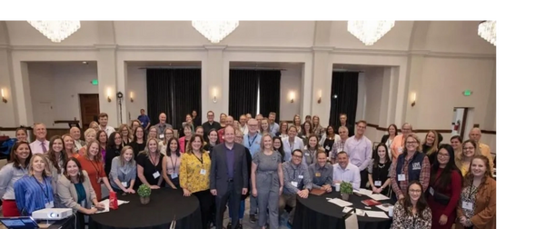 Attendees of 2024 CCA Annual Conference with Governor Jared Polis
