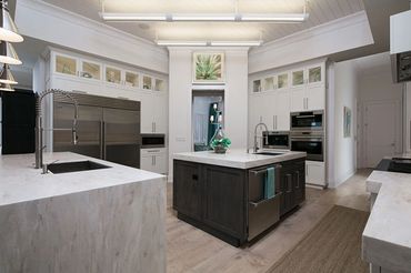 kitchen remodel white cabinets, quartz waterfall countertops