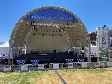 Outdoor stage setup at Park City Canyons Village for Forum Fest event.