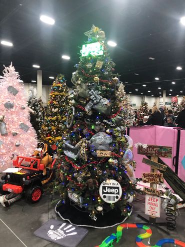 Christmas tree decorated with Jeep-themed ornaments and signs.