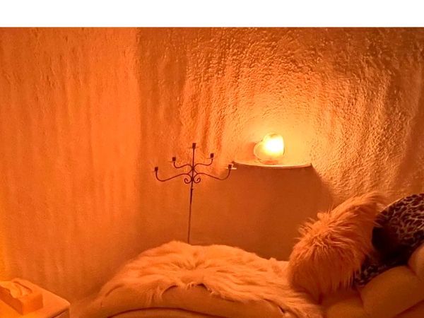 Cozy corner with warm lighting and soft textures.