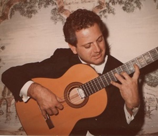 A person holding a guitar