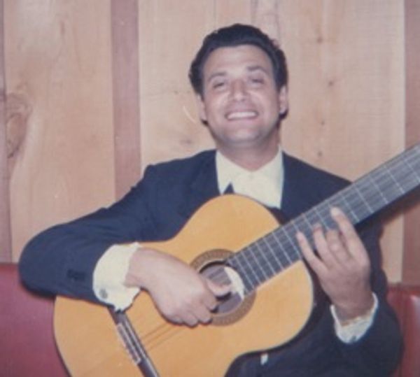 A person holding a guitar