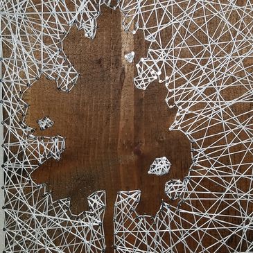 string art with strings on outside of tree figure