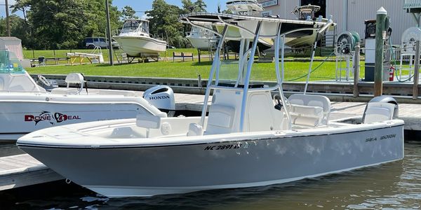 The Gray Boat, a center console Sea Born, docked at a marina.
