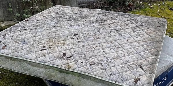 Mattress illegally dumped on property removed in Palmdale, CA by Family Junk Removal team