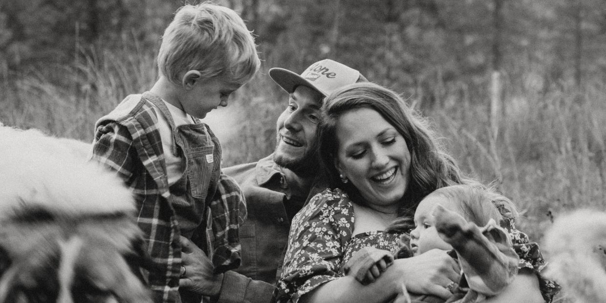 Happy family moment outdoors with parents and children.