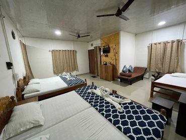 Deluxe cottage room interior at Greenwoods Nature Camp