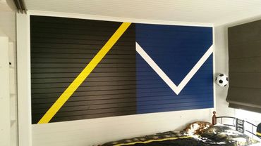 Custom bedroom feature wall with Richmond and Melbourne Victory football colours