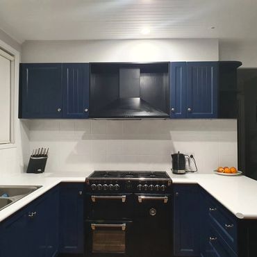 Modern kitchen with freshly painted navy cabinets in Melbourne home