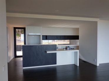 Contemporary kitchen repaint with clean lines and matte finishes