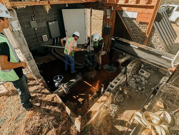 Using a crane to install a new pump and motor