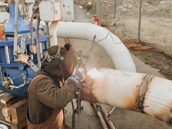 Welding Services - Welding a pipe in the field