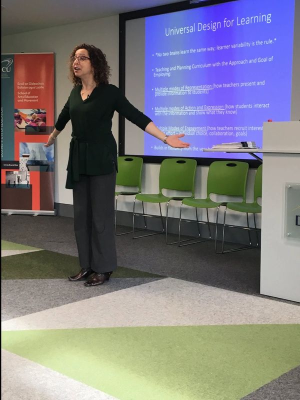 Woman giving a presentation on Universal Design for Learning.