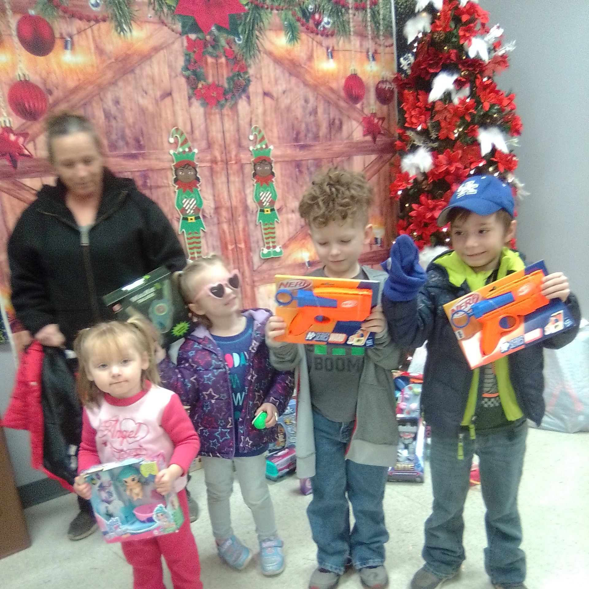 Children receiving Christmas gifts