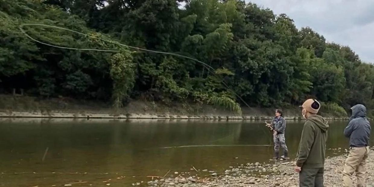 Master Two-Handed instructor Bill Higashi demonstrates a switch casts for student in Japan.