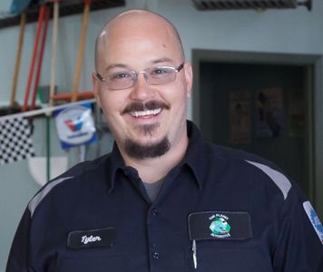 Tyler Dowling, Co-owner, ASE-certified Master Technician, with 20 years of automotive experience.