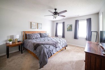 Primary bedroom includes large walk in closet and en suite bath