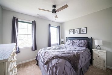2nd bedroom with queen bed- shares hall bath