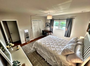 Another view of the primary bedroom