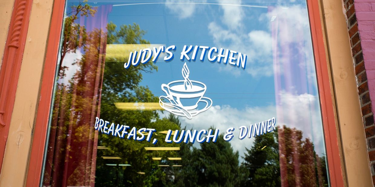 Judy's Kitchen printed on the window