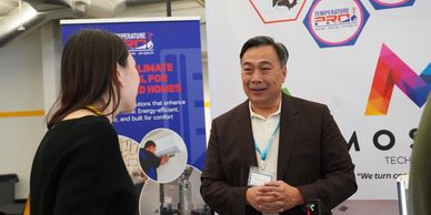 Image of two people conversing taken at a Community educational event during Silicon Valley Smart Li