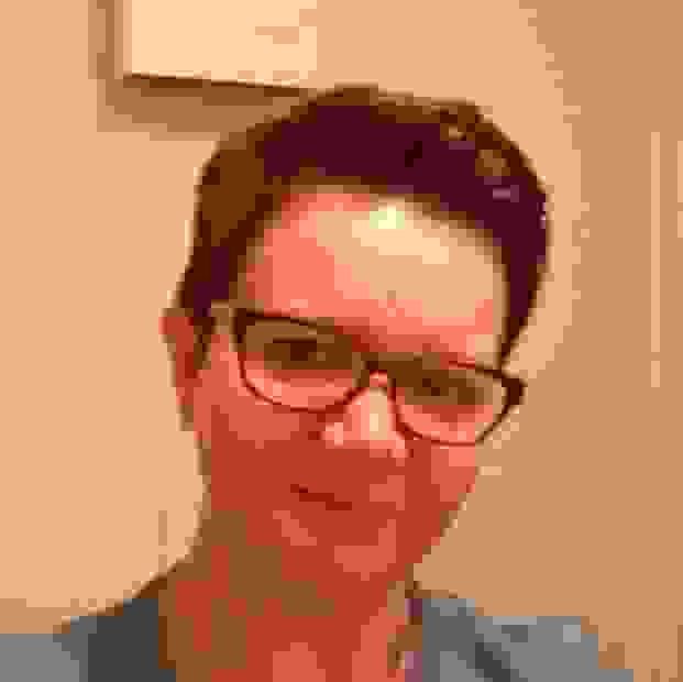 Image of Counsellor Shelley, she has short brown hair, glasses and looks friendly.