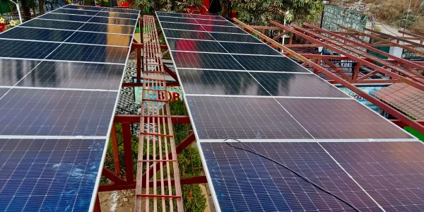 Solar panels installed on a metal framework outdoors.