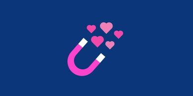 A pink and white magnet attracting pink hearts