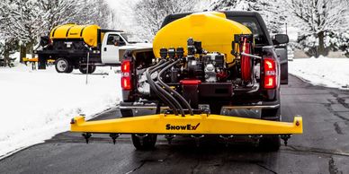A work truck in Surrey equipped with a brine spreader for eco-friendly salt and de-icing solutions.