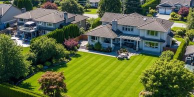 Professional lawncare in Surrey BC, with perfect diagonal mowing stripes on a large residential lawn